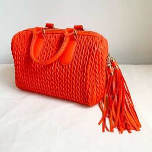 Orange bag. Very roomy with inside pockets.